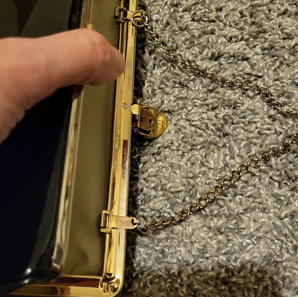 Elegant Black Clutch Bag with gold-tone hinged clasp and gold chain